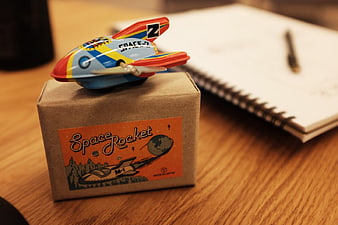 Vintage Space Rocket Toy on Cardboard Box