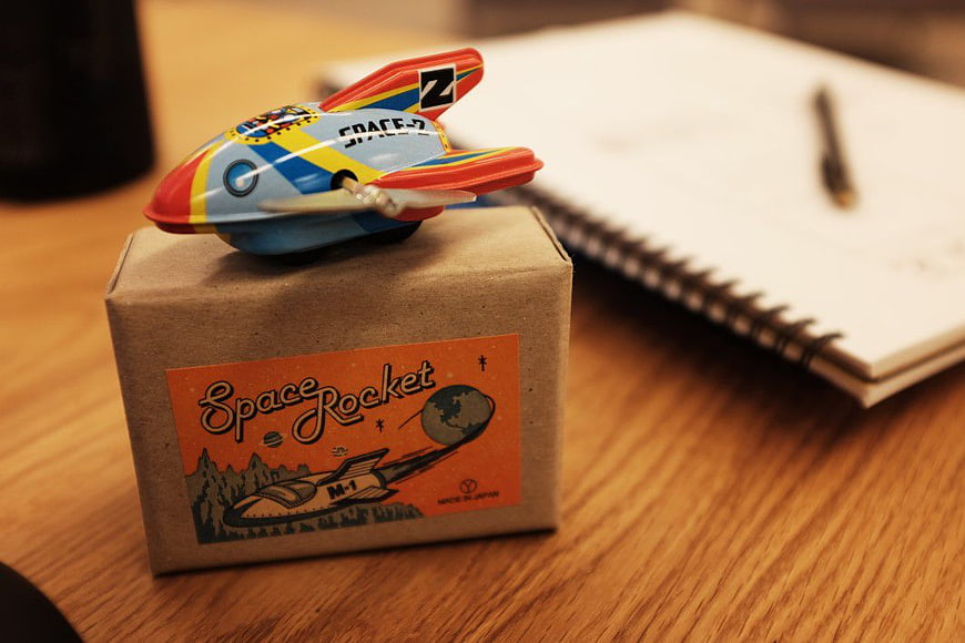 Vintage Space Rocket Toy on Cardboard Box