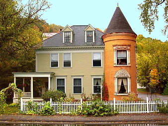 Historic New England Victorian House With Brick Tower In Autumn