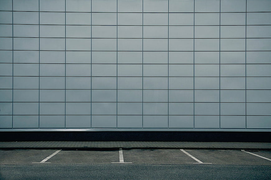 Minimalist gray tiled wall with parking lot lines