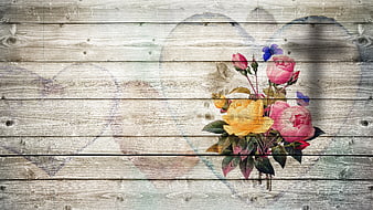 Vintage floral bouquet on rustic wooden background with heart