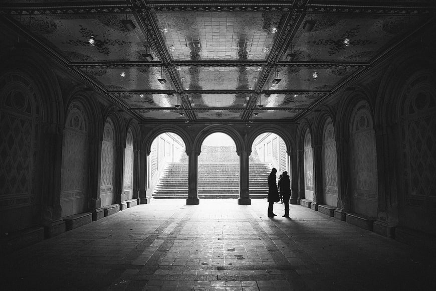 Silhouetted Couple in Grand Arched Hallway Black and White
