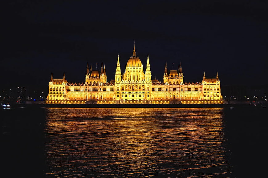 Hungarian Parliament Building Illuminated at Night on Danube