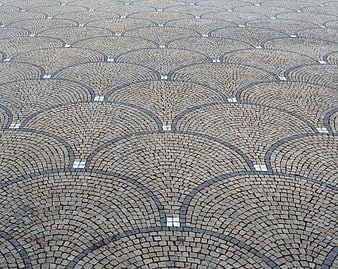 Decorative Cobblestone Pavement with Scalloped Arch Pattern