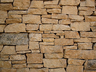 Textured Brown Stone Wall Background Pattern