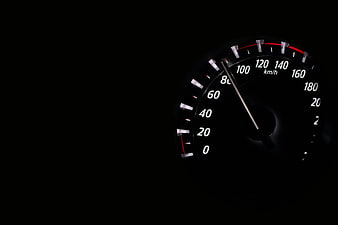Car Speedometer at Night Showing 90 km/h