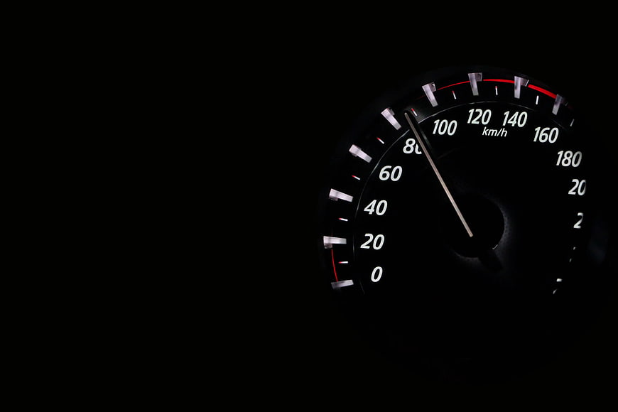 Car Speedometer at Night Showing 90 km/h