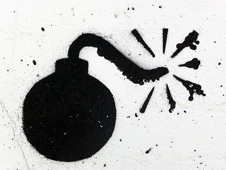 Black Spray Paint Bomb Icon On White Wall