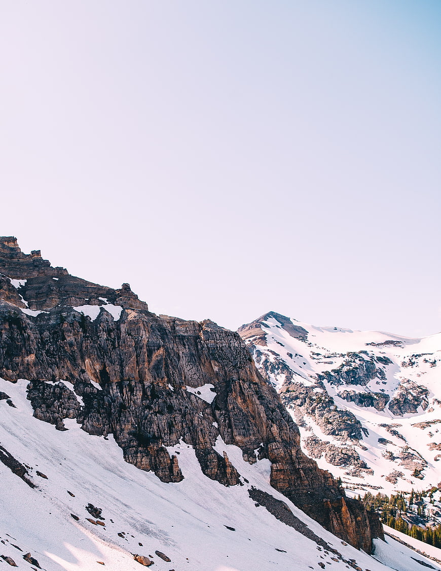 Snowy Mountain Peaks with Vast Sky for Text Overlay