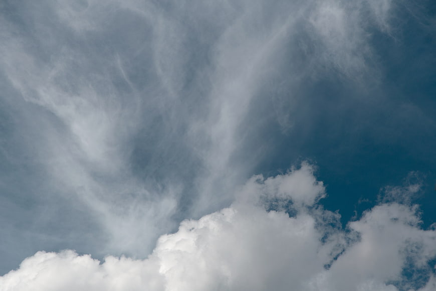 Dramatic wispy cirrus clouds against deep blue sky