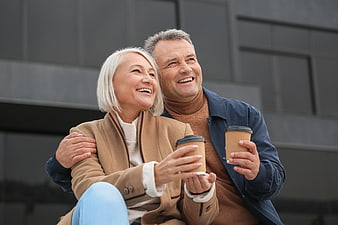 Happy Senior Couple Drinking Coffee Outdoors