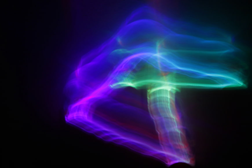 Abstract Neon Light Trails Forming Mushroom Shape
