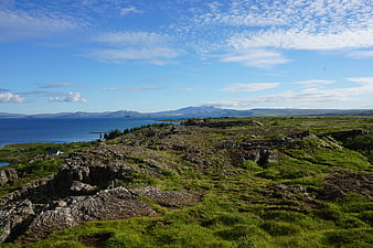 Scenic Icelandic Landscape with Rocky Terrain and Blue Ocean