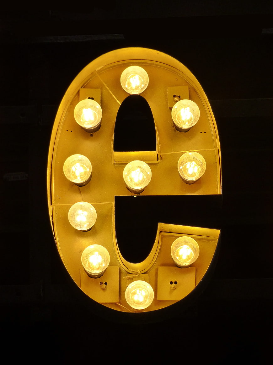 Illuminated Letter E Marquee Sign With Vintage Light Bulbs