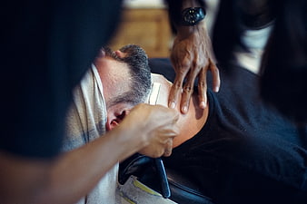 Barber Shaving Man's Neck with Straight Razor