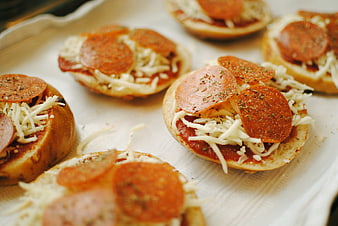 Uncooked Mini Pepperoni Pizzas on Baking Tray