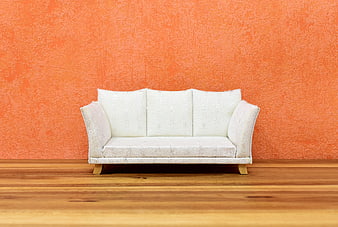 White Sofa Against Orange Wall