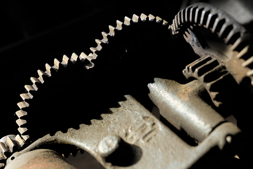 Close-up of rusty metal gears and chain mechanism