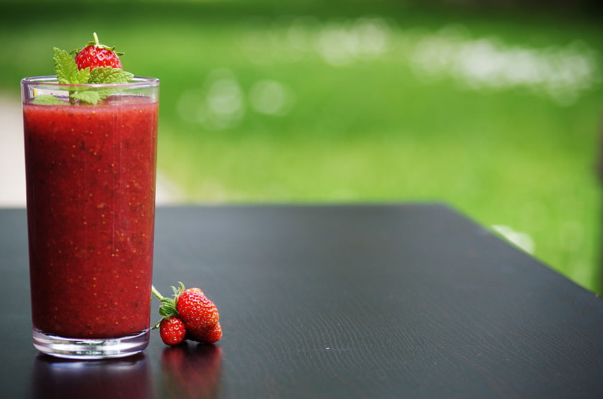 Fresh Strawberry Smoothie with Mint Garnish on Dark Table