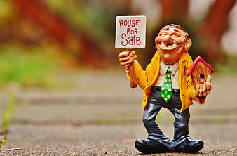 Garden Gnome Real Estate Agent Holding House For Sale Sign