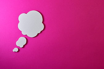 White paper thought bubble on vibrant pink background