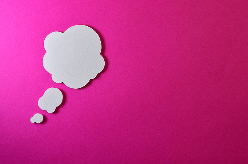 White paper thought bubble on vibrant pink background