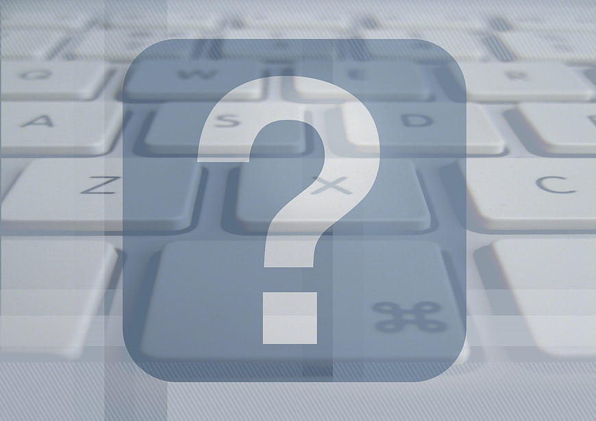 Question Mark Icon on Blurred Keyboard Background