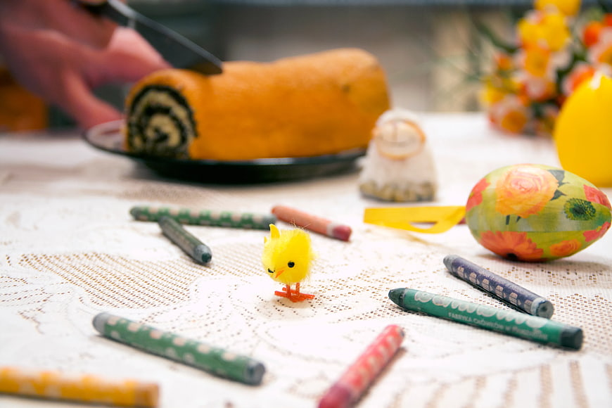 Easter Table Setting with Cake, Chick, and Crayons