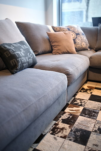 Modern grey sectional sofa with cowhide rug