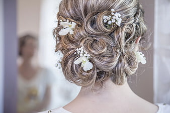 Elegant Blonde Updo with White Baby's Breath Flowers