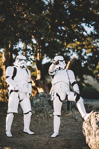 Two Stormtroopers in White Armor Posing Outdoors