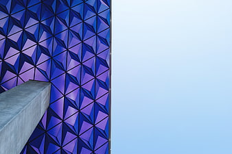 Modern Blue Geometric Facade with Concrete Beam