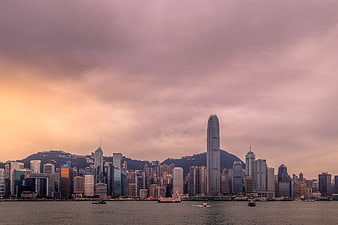 Hong Kong City Skyline Panorama at Dusk with Dramatic Clouds