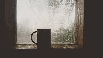 Silhouette of a mug on a frosty window sill