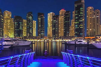 Dubai Marina Night Skyline With Yachts And Neon Bridge