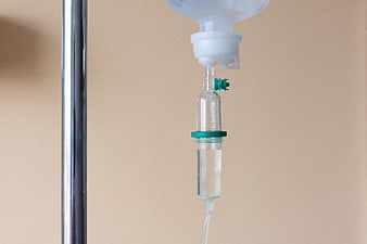 Close-up of IV drip infusion set with medical fluid