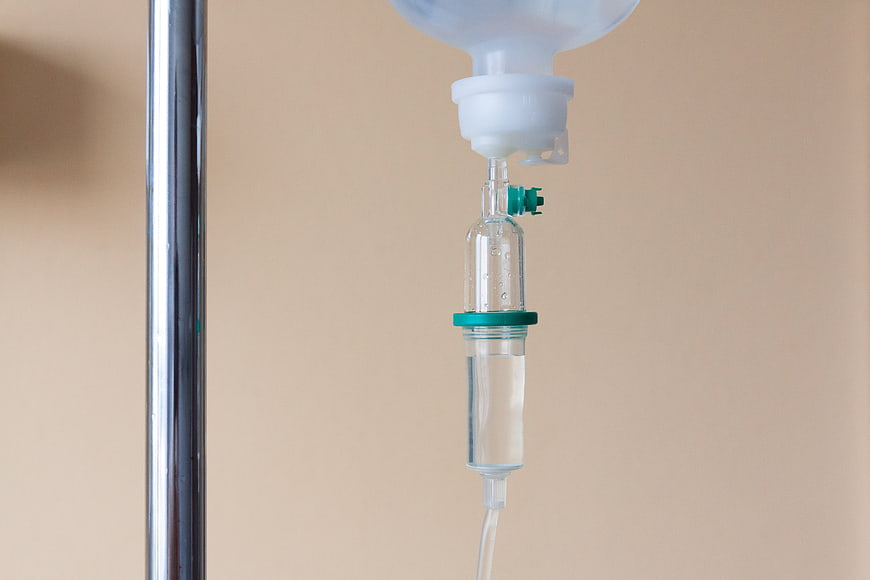Close-up of IV drip infusion set with medical fluid