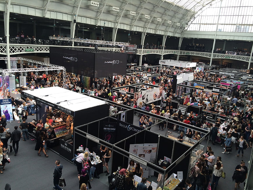 Crowded Beauty Trade Show Exhibition Hall Interior