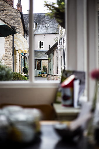 View of quaint village street through cafe window