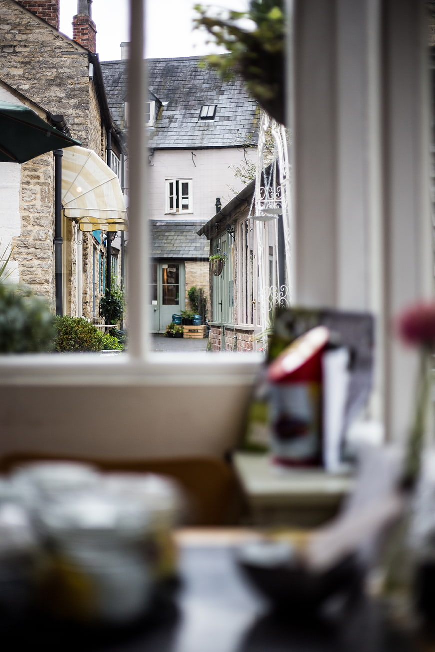 View of quaint village street through cafe window
