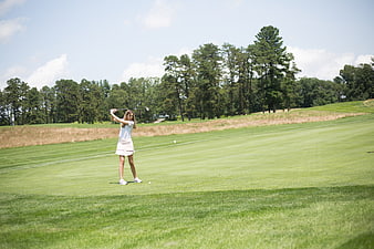 Woman Golfing on Green Course