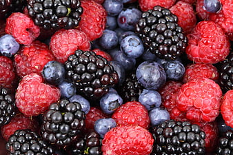 Close-up of fresh mixed berries: raspberries, blackberries, and blueberries