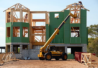 House Framing Construction with Telehandler and Workers
