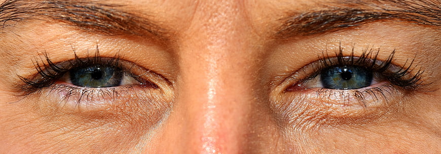 Close-up of blue eyes with natural skin texture