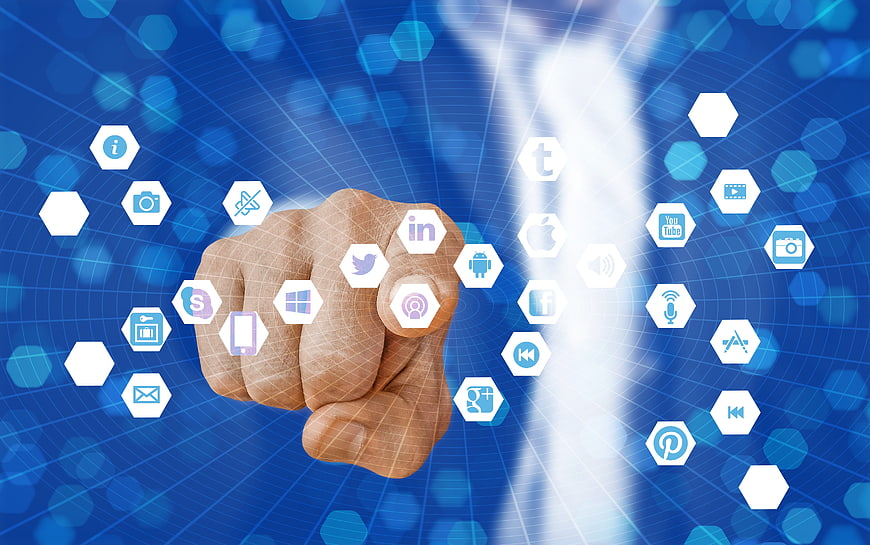 Hand Touching Digital Social Media Icons on Blue Background