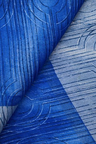 Blue patterned silk fabric texture close-up
