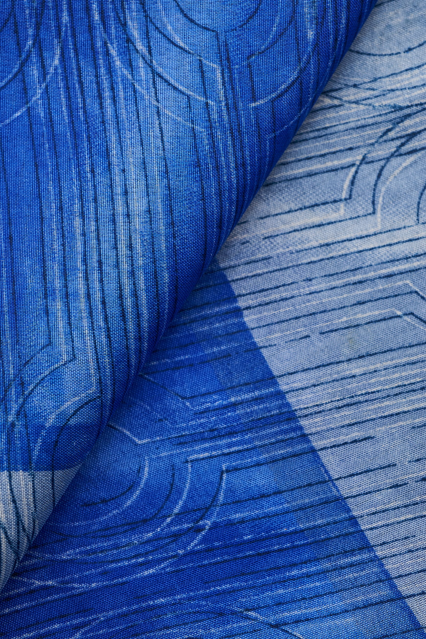 Blue patterned silk fabric texture close-up