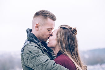 Romantic Couple Kissing Outdoors in Winter