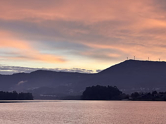 Serene Sunset Landscape with Wind Turbines on Mountain Ridge