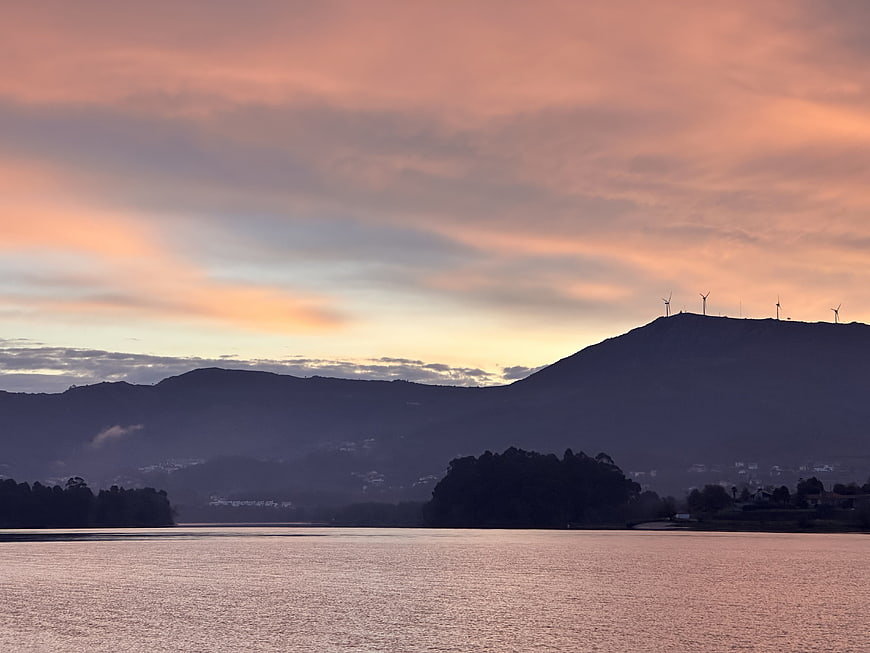 Serene Sunset Landscape with Wind Turbines on Mountain Ridge